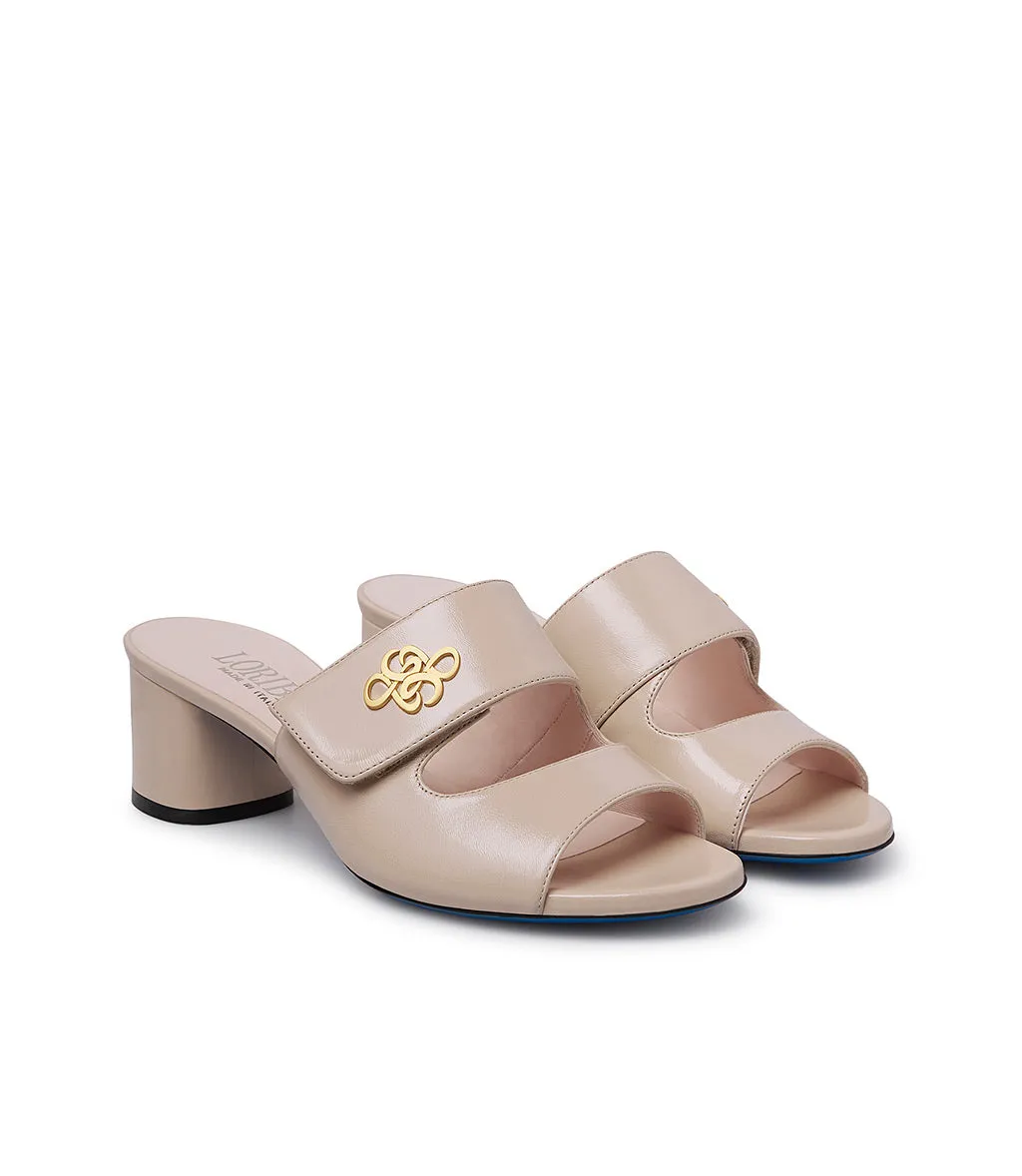 gold metal logo sand leather mules