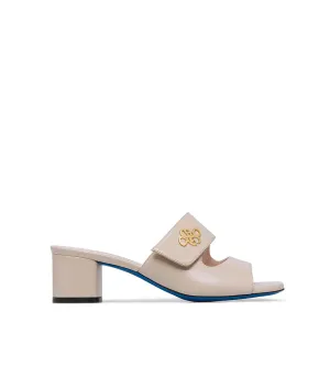 gold metal logo sand leather mules